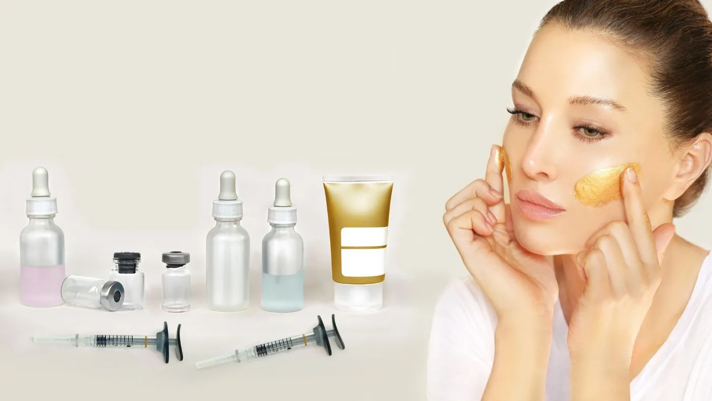 This picture shows a lady with a gold face mask on with beauty products | The Aesthetic Surgery | Durham