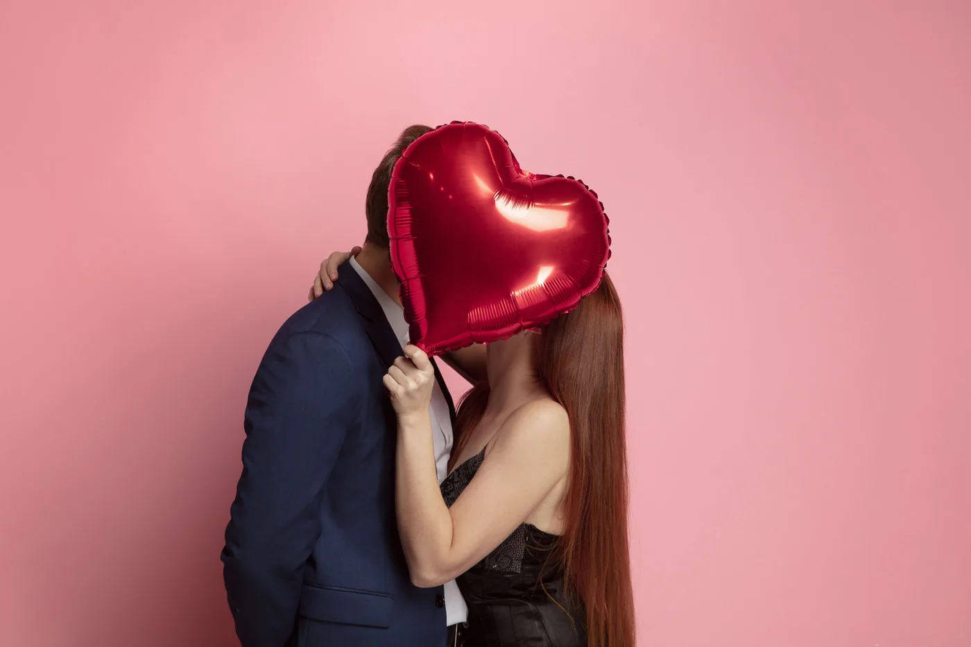 romantic photo shoot with a couple and a heart shaped balloon